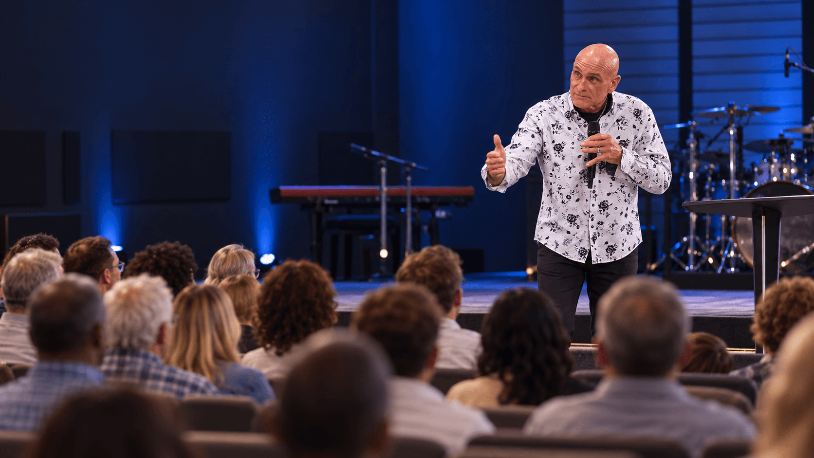 Kevin Bishop preaching to a congregation.